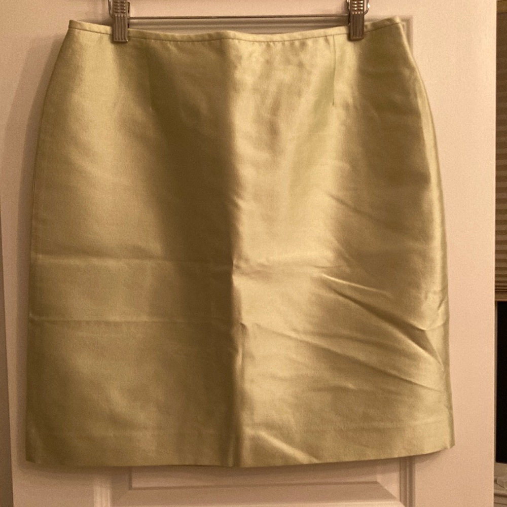 Tahari light green lined skirt with small slit. Medium, below knee. 4/$20